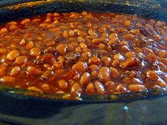 a pot filled with beans sitting on top of a stove