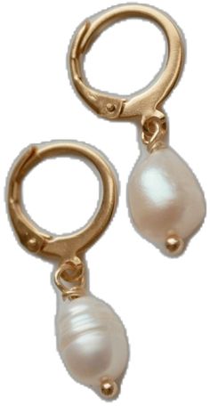 two pearls are hanging from the end of a pair of gold hoop earrings