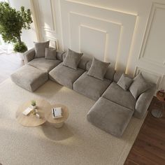 a large sectional couch sitting on top of a living room floor