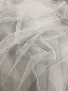 an abstract photograph of white sheer fabric