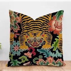 a decorative pillow with an image of a tiger on it