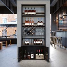 an open wine rack in the middle of a room