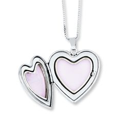 This mother and daughter necklace set features a heart-shaped locket and pendant with an enamel rose. The locket also includes the message "I love you." The set is crafted of sterling silver and comes with 14- and 18-inch box chains so mother and daughter have the perfect fit. Each necklace is secured with a spring ring clasp.