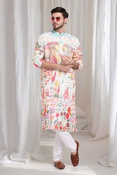 Cream cotton kurta with multi color floral thread and sequins embroidery. Paired with solid churidaar. - Aza Fashions Multicolor Printed Kurta With Traditional Drape, Multicolor Traditional Drape Kurta With Printed Motifs, Multicolor Cotton Kurta With Resham Embroidery, Traditional Drape Multicolor Kurta With Printed Motifs, Multicolor Traditional Wear With Zari Work For Spring, Multicolor Resham Embroidered Cotton Kurta, Spring Multicolor Kurta With Zari Work, Festive Sherwani With Multicolor Floral Embroidery, Spring Multicolor Traditional Wear With Zari Work