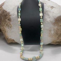 Immerse yourself in the enchanting allure of the sea with this exquisite 18" minimalist mystic mermaid necklace! 💎 Meticulously handcrafted with vibrant jade beads, shimmering gold accents, and mesmerizing aquamarine stones, this piece exudes oceanic elegance and natural beauty. Each bead and gemstone has been carefully selected and strung together to create a harmonious blend of colors that evoke the depths of the ocean. The minimalist design allows the stunning materials to take center stage, making this necklace a true statement piece. Whether you're a mermaid at heart or simply appreciate unique and meaningful jewelry, this necklace is sure to captivate. Wear it to embrace the allure of the sea or as a reminder of the beauty that lies beneath the waves. 🌊 ✨Elevate your jewelry collec Aquamarine Beads, Mermaid Necklace, Meaningful Jewelry, Aquamarine Stone, Jade Beads, Center Stage, Gold Accents, Wearable Art, The Ocean