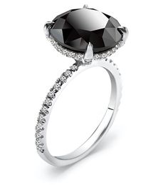 a black diamond ring with diamonds on it