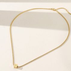 Durable and stylish, our waterproof necklace is crafted for both functionality and fashion. Perfect for any occasion, it's the ideal accessory for those who appreciate durability and timeless elegance. Perfect for the minimalist and a beautiful piece to layer with. A true versatile statement piece that you can wear straight from the pool to dinner! - 18K gold plated / stainless steel - Waterproof technology - 18" in length - Necklace + 1 cube (initial or sign) = $45 - Additional cubes with lette Adjustable Minimalist Chain Necklace Choker, Minimalist Choker Jewelry With Adjustable Length, Minimalist Adjustable Choker Jewelry, Everyday Jewelry With Delicate Square Pendant Chain, Minimalist Adjustable Choker Necklace, Minimalist Charm Necklace With Adjustable Chain, Everyday Square Pendant Clavicle Chain Jewelry, Minimalist Jewelry With Delicate Chain And Square Pendant, Everyday Square Pendant Clavicle Chain