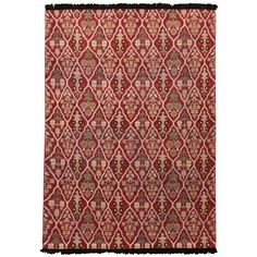 a red and brown rug with an intricate design on the bottom, in front of a white background