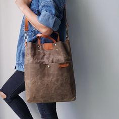 Waxed Canvas Unisex Tall Sling Tote Bag in Brown with Genuine | Etsy Waxed Canvas Satchel With Large Capacity, Large Capacity Waxed Canvas Satchel Shoulder Bag, Practical Shoulder Bag With Waxed Finish For Everyday Use, Everyday Khaki Bags With Leather Handles, Khaki Backpack For Everyday Use, Khaki Waxed Finish Bags For Daily Use, Large Capacity Waxed Canvas Crossbody Bag, Khaki Waxed Finish Shoulder Bag For Everyday Use, Khaki Leather Bags With Pockets