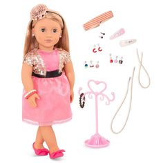 a doll is standing next to some accessories