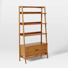 a tall wooden shelf with drawers next to it