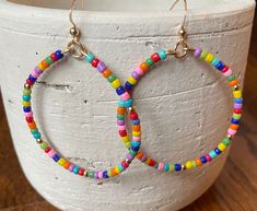 Gold filled beaded hoops. These hoops measure 2 inch in diameter. Adjustable Circular Beaded Earrings With Tiny Beads, Adjustable Round Beaded Earrings With Tiny Beads, Adjustable Hoop Beaded Earrings With Colorful Beads, Adjustable Colorful Beaded Circle Hoop Earrings, Summer Hoop Earrings With Colorful Beads, Trendy Hoop Beaded Earrings With Colorful Beads, Adjustable Beaded Hoop Earrings, Adjustable Colorful Beaded Round Earrings, Colorful Beaded Circle Earrings For Summer