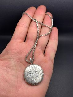 It is a English hallmarked, vintage, round, ornate, locket/pendant, with a silver chain, there is a silver hallmark on the clasp, weight 23 g, pendant height 4.2 cm, 3.2 cm diameter, chain is 55 cm long, in a good condition. Silver Locket, Cabochon Ring, Silver Lockets, Adjustable Rings, Locket, Silver Fashion, Hallmark, Antique Silver, Silver Chain