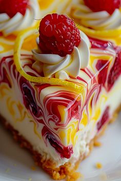 a piece of cheesecake with raspberries on top