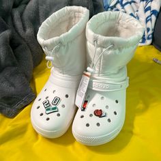 Never Worn Croc Snow Boots, Casual White Insulated Boots, Comfortable White Round Toe Boots, Waterproof White Boots For Spring, White Waterproof Boots For Spring, Casual White Waterproof Boots, Comfortable White Winter Boots, Casual Synthetic Boots For Winter, White Sporty Boots For Spring