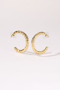 These molten hoop earrings are so versatile and offering subtle sparkle and essential style, you'll reach for them every day. Crafted in 18k gold plated brass, with lines of round brilliant-cut pavé diamond-like zircon stones, these hoop earrings designed to allow you to have fun styling in two ways, you can simply swap each side around to showcase the molten sculpted details or the emerald green zircon stones. Handmade item 18k gold plated brass High quality zirconia stones Hypoallergenic 925 s Textured Gold-plated Hoop Earrings, Textured Gold Plated Hoop Earrings, Elegant Hammered Gold Plated Hoop Earrings, Elegant Textured Gold Plated Hoop Earrings, Hammered Gold-plated Small Hoop Earrings, Small Gold Plated Hammered Hoop Earrings, Small Hammered Gold-plated Hoop Earrings, Textured Gold-plated Jewelry, Small Hoop Gold Plated Earrings With Plating