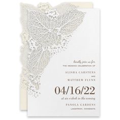 a wedding card with white lace on it