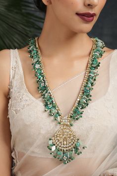 Green Kundan Inspired Necklace .This beautifully handcrafted necklace is set in silver and copper alloy and plated with 22k gold. This necklace with a twist of Pearl stones by Paisley Pop is a perfect accessory for an Indian Bride. Necklace Size - Length 36 inc, Width 1.5 inc Closure - Adjustable Thread Dori Style Tip - Wear this with almost anything Indian for a rich and royal look because nothing more regal than kundan necklace set. We love teaming this with classy chiffon sarees or zari silk Luxury Kundan Necklace With Zari Work For Designer Wear, Luxury Festive Kundan Necklace With Emerald, Luxury Spiritual Kundan Necklace With Gemstones, Luxury Kundan Jewelry With Dangling Beads, Luxury Kundan Gemstone Necklace For Party, Luxury Silver Kundan Necklace With Meenakari, Luxury Fusion Style Kundan Necklace With Gemstone, Luxury Hand-set Kundan Pendant Necklace, Luxury Fusion Style Kundan Necklace For Party