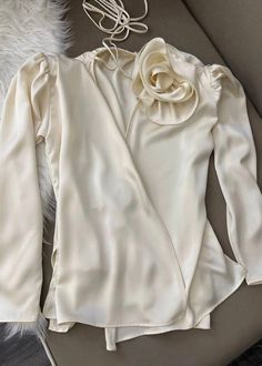 This 3D flower decor blouse features a flattering v-neck design and loose, comfortable fit. Made from luxurious satin fabric, it drapes beautifully and is available in a versatile beige color. With long sleeves, it is perfect for any occasion. Fabric: Non-Stretch Material: Polyester, Cotton Flower Decor, Satin Blouse, Beige Color, Satin Fabric, Neck Designs, Flower Decorations, Comfort Fit, Long Sleeves, Satin