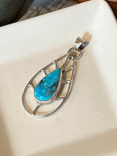 "Main Stone:  Sleeping Beauty Turquoise Metal:  Sterling Silver Style:  Pendant Pendant Size: 1\" x 2\" Key Features: Brilliant Blue Sleeping Beauty Turquoise pendant This beautiful Sleeping Beauty pendant will be a favorite among your jewelry!!  The pendant was inspired by the beautiful changing leaf colors of Colorado; you can wear it for all occasions.  The stone was mined in Arizona and is a popular choice for many.   Sleeping Beauty is a beautiful stone that is becoming hard to find, the mine has been closed so stones are rare.  The stone is complimented by the gorgeous southwestern designed sterling silver and would be a great gift to that special someone, or treat yourself to it! Mined in:  Arizona Created in:  Manassa, Colorado Care instructions:   To prolong the life of your jewel Southwestern Turquoise Necklace With Large Stone As Gift, Artisan Teardrop Turquoise Necklace Nickel Free, Turquoise Teardrop Necklace In Southwestern Style, Bohemian Turquoise Necklace With Large Teardrop Stone, Artisan Turquoise Teardrop Necklace Nickel Free, Bohemian Teardrop Turquoise Necklace Nickel Free, Teardrop Turquoise Necklace With Large Pendant For Gift, Artisan Turquoise Teardrop Necklace With Large Pendant, Bohemian Turquoise Teardrop Necklace With Large Stone