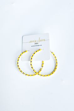 The classic hoop design is timeless, yet the addition of the intricate beading adds a modern twist, making these a must-have jewelry piece looking to be added to your collection. Available in several colors, these are great to add the accent color needed to complete a look! These are also great for cheering on your favorite sports team. 45mm size hoop medium weight gold plated over brass earring hoop Trendy Tiny Beads Earrings For Summer, Trendy Round Beaded Chain Jewelry, Trendy Jewelry With Beaded Chain, Spring Jewelry With Tiny Round Beads, Summer Beaded Earrings With Tiny Beads, Spring Jewelry With Colorful Beads In Gold, Trendy Gold Beaded Earrings For Summer, Trendy Gold Beads For Summer, Spring Gold Jewelry With Colorful Beads