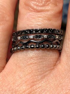 Looking for something unique and one-of-a-kind? This is one of my favorite stacking sets. Natural black sapphires and black spinel with black rhodium and sterling silver create a premium design effect. Gorgeous combination for wedding bands or engagement options. A great cosmos and earthy theme. This set is a size 7, but we can arrange other sizing if you would like? Fine Jewelry Stackable Black Diamond Rings, Black Stackable Rings Fine Jewelry, Fine Jewelry Black Stackable Rings, Fine Jewelry Black Stackable Jewelry, Black Stackable Fine Jewelry Rings, Black Spinel Jewelry For Anniversary, Black Stackable Fine Jewelry, Elegant Black Bands For Anniversary, Elegant Black Anniversary Bands