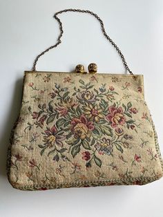 "Vintage 1960s Shoulder Bag Tapestry Chain Purse. Gold frame with decorative Kiss Clasp Closure. Multi Floral Tapestry Motif on Ivory Background. Peach Sateen Lining. Gold tone 5\" chain This is an absolute must for the Tapestry Handbag Collector.-- Very Good Condition  Measurement: 5.5\" x6.5\" x 1\" 5.5 Chain drop" Tapestry Handbag, Victorian Style Wedding, Tapestry Handbags, Ivory Background, Chain Purse, Vintage Chain, Vintage Tapestry, Floral Tapestry, Wedding Bag