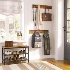 the entryway is clean and ready to be used as a shoe storage area for shoes