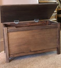 an old wooden trunk is sitting on the floor