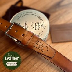 "VEGAN Leather (Not Genuine Leather) Belt PERSONALISED Mens Belt - Custom Leather Belt - Anniversary Gift For Him - Engraved Leather Belt - Monogrammed Belt ➤ HOW TO ORDER * Choose your size from our chart and the color of the belt. * Choose the engraving options and ''+Tin'' if you want it to come with     personalization metal box. * Please put the monogram number you choose from our chart and     font number in the ''personalization '' box. - Feel free to contact me if you want your logo or h Leather Belt With Brass Buckle As Gift, Personalized Leather Belts For Men, Custom Brown Engraved Belts, Adjustable Engraved Brown Belt, Initials Leather Belt For Men, Custom Leather Belts, Engraved Handwriting, Birthday Gifts For Husband, Boyfriend Birthday