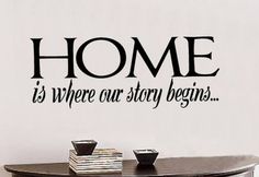 a wall decal with the words home is where our story begins in black on a white background