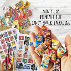 a person holding up some candy in their hand with the words miniatures printable file candy snack packaging