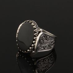 Flat Onyx Silver Men Ring. Handmade in 925 sterling silver with onyx stone. On the ring Oval black agate - aqeeq, onyx stone settled. Sides has elegance ornaments. Dimensions of stone is 15 mm x 20 mm. Average weight of Flat Onyx Silver Men Ring is 14 gr. (depends your ring size). Back side is open to touch your skin. Classic and exclusive style. Stone Type: Agate - Aqeeq, Onyx Stone Color: Black Stone Dimensions: 15 mm x 20 mm Stone Shape: Oval, Flat Average Weight: 14 gr. Made in Istanbul, Tur Luxury Black Engraved Ring In Sterling Silver, Black Sterling Silver Signet Ring With Polished Finish, Classic Black Sterling Silver Engraved Ring, Black Oval Engraved Sterling Silver Ring, Oval Black Sterling Silver Engraved Ring, Silver Onyx Signet Ring With Polished Finish, Black Enamel Sterling Silver Signet Ring, Silver Onyx Signet Ring, Silver Onyx Signet Ring Luxury Style