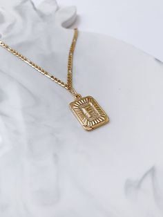 A perfect personalized jewelry. Add any initial of your choice to our gold plated thick curb chain, with a gold pendant necklace featuring a rectangle letter charm. Wear it alone for a minimalist look, or layer it with other necklaces. This is the perfect gift idea for your best friend, sister, mother and daughter. If you would like to add more than one letter to the necklace, please select the option from dropdown and specify which letter you would like by sending me a note. Necklace clasp: lob Personalized Gold Necklace With Rectangular Links, Gold Necklace With Personalized Rectangular Links, Gold Initial Necklace With Rectangular Pendant, Gold Tarnish Resistant Initial Necklace With Rectangular Pendant, Gold Engraved Rectangular Charm Necklaces, Gold Engraved Rectangular Charm Necklace, Gold Rectangular Initial Necklace, Personalized Gold Rectangular Charm Necklace, Gold Rectangular Minimalist Name Necklace