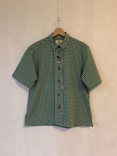 Vintage Gray Moss Green Women Checkered Blouse Loden Shirt Short Sleeve Blouse Button up Trachten Shirt Austrian Shirt Size Medium to Large Label size: 40 Estimated size: M/L Measurements (lying flat): Shoulders: 17,5"/ 44 cm Sleeve: 11,5"/ 29 cm Pit to pit: 21.5"/ 55 cm Waist: 21"/ 53 cm Length: 26.5"/ 67 cm Please check measurements to insure a proper fit. Remember to allow yourself some extra room for movement. You can compare these with something from your closet that fits you well. This blo Checkered Button Down Shirt Outfit, Green Short Sleeve Button Up Outfit, Cheap Vintage Short Sleeve Shirt With Button Closure, Checkered Button Up, Green Checkered Shirt Outfit, Cheap Gingham Shirt With Button Closure, Plaid Cotton Button-up Blouse, Summer Plaid Tops With Placket, Casual Collared Blouse With Covered Buttons