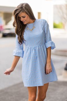 Spring and summer time call for seersucker everything! Which makes this dress a must have! It's so precious and classy! We particularly love the flounce sleeves! Material has no amount of stretch. Miranda is wearing the small. Sizes fit: Small- 0-4; Medium- 6; Large- 8 Walking Down The Street, Blue Striped Dress, White Striped Dress, Ladies Dress Design, Striped Dress, Casual Dresses For Women, Summer Time