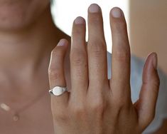 Sterling silver signet ring for women, minimalist custom engraved initials pinky ring.This simple and dainty signet ring is made of sterling silver. It will be especially beautiful as a pinky ring will look great on any finger you choose to wear it. The ring is not hollowed and has a shiny finish, also on the inside. This ring can be customized: It can be hand engraved to up to 3 letters. The engraving can be made with a font of your choosing - you can even write it in your own handwriting.Nothi Modern Adjustable Signet Ring, Minimalist Initial Ring With Engraving Option, Minimalist Engraved Ring With Engraving Option, Minimalist Silver Signet Ring With Polished Finish, Minimalist Oval Sterling Silver Signet Ring, Adjustable Dainty Signet Ring, Minimalist Initial Ring In Polished White Gold, Minimalist Sterling Silver Dome Ring Stamped 925, Sterling Silver Tarnish Resistant Initial Ring