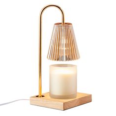 a table lamp with a wooden base and a white glass candle on the end,