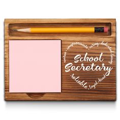 a wooden plaque with a notepad, pencil and eraser on it that says school secretary