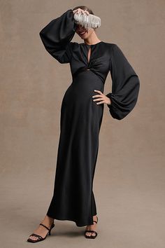 A slim midi silhouette boasts full-length balloon sleeves and twisted-front detailing to create an enchanting statement. An alluring open back and center front cutout set the Significant Other Demi Long-Sleeve Column Gown apart. | Demi Backless Long-Sleeve Column Gown by Significant Other in Black, Women's, Size: 4, Polyester/Rayon/Elastane at Anthropologie Long Sleeve Bridesmaid Dress, Black Bridesmaids, Guest Attire, Wedding Attire Guest, Black Bridesmaid Dresses, Column Gown, Long Black Dress, Little White Dresses, Significant Other