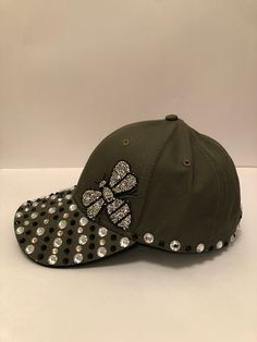 This a fun, grab and go women's baseball cap for those who are partial to a little bit of bling.  This cap can be worn almost anywhere. On days out, meeting up with friends, shopping trips, parties, festivals, holidays etc. This cap is made from 100% Cotton, making it soft and breathable.  This cap comes in one size with an adjustable rip strap to help maintain the perfect fit. This product is Handmade. I only make products that I too, would be happy to wear.  * Recommend: Hand Wash and Hang up to Air Dry. Friends Shopping, Wife Style, Womens Baseball Cap, Days Out, Trucker Cap, Crystal Clear, Army Green, Hats For Men, Baseball Cap