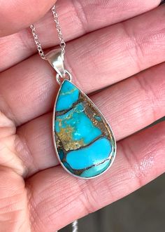 "Natural, Basalt, Turquoise (Arizona), Pendant necklace, set in 925 sterling silver bezel setting (with open back), and 22\" inches long chain. --Pendant Bail Included: 1.65\" x 0.75\" inches. --Stone: 30mm x 18mm, Teardrop." Blue Teardrop Necklace With Large Stone, Turquoise Teardrop Cabochon Necklace, Teardrop Turquoise Necklace With Large Stone, Turquoise Teardrop Pendant Necklace With Large Stone, Blue Turquoise Necklace With Large Teardrop Stone, Unique Blue Teardrop Turquoise Necklace, Blue Turquoise Necklace Stamped 925 As A Gift, Teardrop Turquoise Necklace With Large Pendant For Gift, Southwestern Blue Teardrop Pendant Necklace