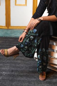 When aiming for an effortlessly chic look, nothing beats a pair of elegant, flowing pants. These Sharara pants are your go-to for evenings when a dress feels too formal and jeans too casual. The luxurious fabric drapes beautifully, creating a sensuous and polished silhouette. Custom embroidery adds a touch of detail and flair, making these pants a standout piece. Say goodbye to outfit dilemmas -- these pants do all the work, ensuring you feel both stylish and relaxed. Product Details - Condition Zari Work Pant Set For Summer, Festive Embroidered Straight Pant Set, Designer Embroidered Straight Pants, Straight Palazzo Set With Zari Work, Elegant Festive Designer Bottoms, Elegant Bottoms With Resham Embroidery For Spring, Summer Floral Embroidery Palazzo Set Straight Pants, Elegant Bottoms With Zari Work For Eid, Ankle-length Resham Embroidered Palazzo Set