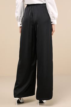 The Lulus Stunning Chicness Black Satin High-Rise Wide-Leg Pants will easily elevate any of your favorite fall 'fits! Sleek woven satin shapes these must-have pants that feature a high, banded waist (with elastic at the back for fit) and trendy, wide pant legs with pleated details, side seam pockets, and full-length hems. Hidden side zipper/clasp. Add a sweater and some boots and you'll instantly have a perfect ensemble! Fit: This garment fits true to size. Length: Floor length. Size medium Inse Sleek Silk Wide Leg Pants, Sleek Silk High-waisted Wide Leg Pants, Sleek Silk Wide-leg Pants, Sleek Wide-leg Silk Pants, Sleek Silk Trousers, Sleek Silk Straight Pants, Silk Wide Leg Pants With Elastic Waistband For Work, Sleek Silk Wide Leg Bottoms, Sleek Silk Bottoms For Work