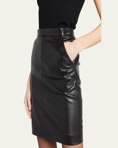 Saint Laurent pencil skirt in lambskin leather     High rise     Concealed back zip     Side slip pockets     Hem falls above the knee    Pencil style    Leather/silk/cotton    Made in Italy Leather Pencil Skirt, Lambskin Leather, Above The Knee, The Knee, Pencil Skirt, Saint Laurent, Tops Designs, High Rise, In Italy