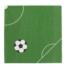 a soccer ball on a green field with white lines