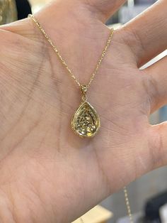 "Beautiful Pear Shape Diamond Necklace set in yellow gold. The diamonds are clear and very sparkling. Elegant and classy shape necklace. It's a nice size pendant, great to wear for any occasion. The diamond cut 14K Yellow Gold Chain has a nice sparkle to it and compliments the pendant perfectly. The chain is solid so it is strong. 18\" chain, let us know if you need a different length chain. Pendant length measures 22mm. The pear shape measures 16.2x12.5mm. Genuine Round Brilliant Cut Diamonds t Luxury Pear-shaped Yellow Gold Diamond Necklace, Formal Yellow Gold Pear-shaped Diamond Necklace, Formal Pear-shaped Yellow Gold Diamond Necklace, Elegant Gold Diamond Necklace With Pear-shaped Pendant, Elegant Gold Pear-shaped Diamond Necklace, Pear-shaped Yellow Gold Diamond Necklace, Fine Jewelry 14k Gold Pear-shaped Diamond Necklace, Yellow Gold Teardrop Diamond Necklace With Prong Setting, Yellow Gold Drop Necklace With Prong Setting