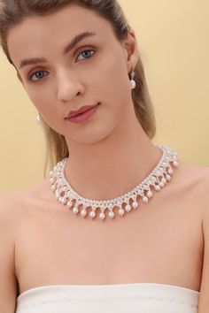 Embrace the opulence of our Vintage Triple-Layer Handcrafted Pearl Necklace, ideal for banquets and weddings. This exquisite piece features three sizes of near-round and oval-shaped pearls, meticulously handcrafted into a luxurious three-layer design. The necklace measures 40cm with an additional 5cm extension, offering flexibility and a perfect fit for any formal attire. Product Details: Pearl Types: Various Sizes, Near-Round and Oval Shapes Craftsmanship: Pure Handcrafted Style: Vintage Luxury Luxury Bridal Pearl Chain Necklace, Elegant Oval Bridal Necklace For Formal Occasions, Luxury Oval Pearl Drop Jewelry, Elegant Akoya Pearl Chain Bridal Necklace, Elegant Bridal Necklace With Akoya Pearl And Pearl Chain, Elegant Akoya Pearl Bridal Necklace With Pearl Chain, Elegant Bridal Necklace With Akoya Pearl Chain, Luxury Oval Bridal Necklace, Pearl Chain Bridal Necklace