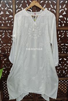 Description ▪ Fabric: Muslin ▪ Sleeves: 3/4 Sleeves ▪ Style: Straight Kurti ▪ Kurti Length: 44-46 Inches ▪ Occasions: Party Wear, Office Wear, Festive Wear ▪ Garment Care: Hand Wash Only ▪ Package Contains: 1x Kurti Disclaimer : Color may be little vary due to lighting effect. Festive White Tunic Set, White Tunic Sets For Eid, White Straight Kurta Tunic For Festive Occasions, White Cutdana Blouse For Eid, Festive White Straight Kurta Tunic, Eid Traditional Wear With Cutwork And Long Sleeves, Long Sleeve Traditional Wear With Cutwork For Eid, Long Sleeve Cutwork Traditional Wear For Eid, White Chikankari Embroidery Kaftan