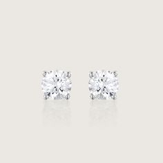 Our Martina earrings are a pair of glamorous 1.04ct diamond earrings. There's nothing more classic to wear than our Martina diamond earrings. They are iconic, classic and beautiful. With their perfect cut and impeccable shape, they are every woman's must-haves. A 5mm White diamond held by 4 white gold prongs and closes with a butterfly back. The earrings are sold as singles The Martina can be worn to top off an exquisite evening look. They are both classic and stunning, and add the perfect sparkle for a polished, feminine style. They can be customized with any stones of your choice. All features can be customized! please contact us if you wish to make changes, we love making custom designs. All of our jewelry is carefully handmade in our atelier *HC diamond are all conflict-free diamonds T White Gold Platinum Diamond Earrings With Single Diamond, Platinum White Gold Diamond Earrings With Single Diamond, Diamond White Solitaire Diamond Earrings, Solitaire Diamond White Diamond Earrings, Timeless Diamond Cut Earrings For Formal Occasions, Formal Diamond Earrings With Brilliant Cut Moissanite, Elegant Platinum Earrings With Single Diamond, White Diamond Earrings With Single Diamond, Formal White Diamond Earrings With Single Diamond